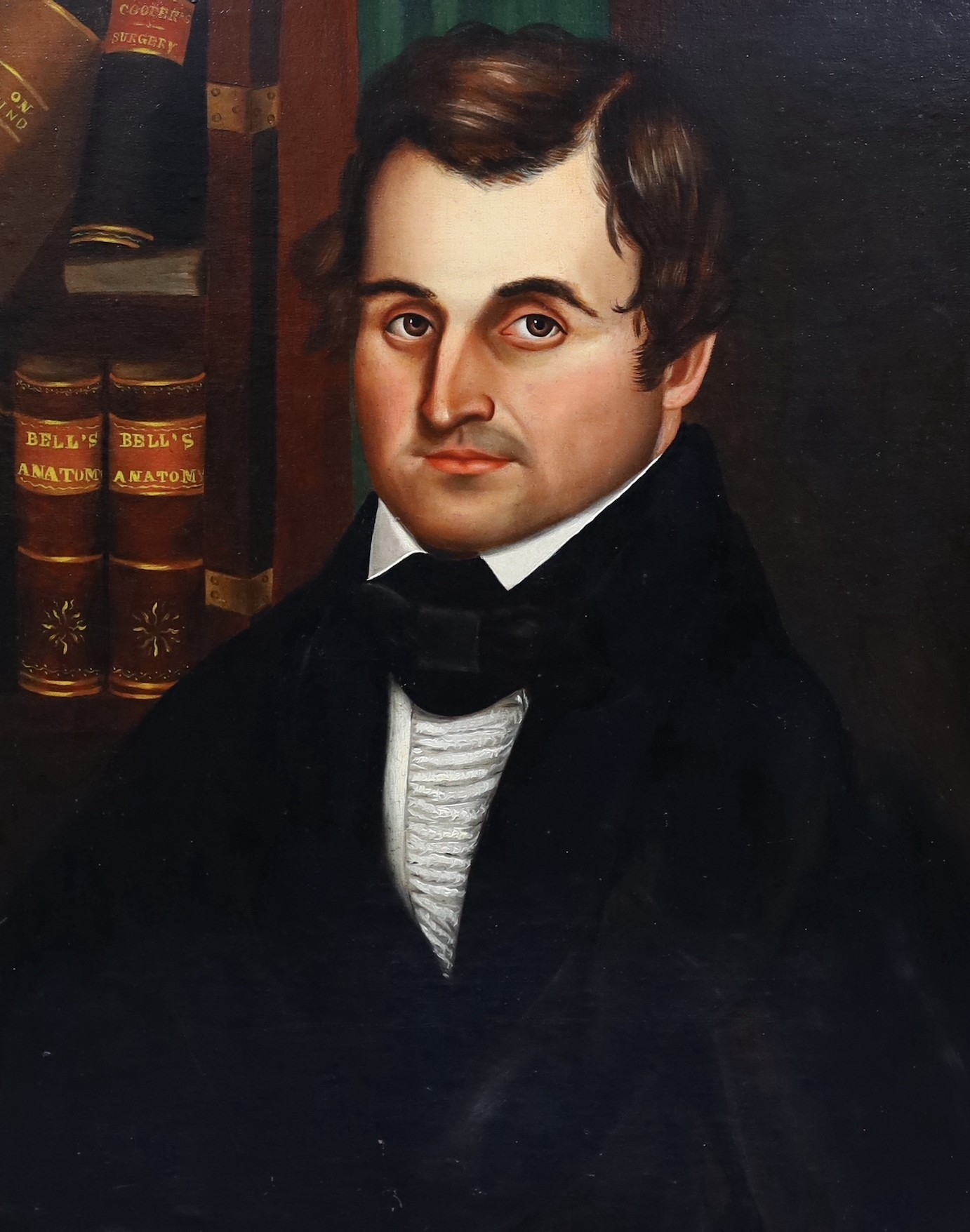 19th century American School, Portrait of Charles Burgess, seated beside a copy of bells anatomy and other medical works, oil on canvas laid on board, 65 x 52cm